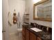 Bathroom featuring dark marble countertops, a decorative mirror and ample storage at 833 21St Ne Ave # 833, Hickory, NC 28301
