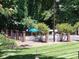 Community pool surrounded by lush greenery and a black fence at 833 21St Ne Ave # 833, Hickory, NC 28301