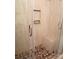 Tiled shower with river rock floor and bench, offering a spa-like experience at 833 21St Ne Ave # 833, Hickory, NC 28301
