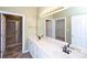 Bathroom with a double vanity, large mirror, and a separate shower, providing ample space and functionality at 8538 Highland Glen Dr, Charlotte, NC 28269