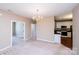 Bright dining area showcasing views into the kitchen and living spaces, great natural light, and open floor plan at 8538 Highland Glen Dr, Charlotte, NC 28269