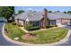 Beautiful view of a brick residence showing lawn, trees, and a well-maintained yard at 8538 Highland Glen Dr, Charlotte, NC 28269