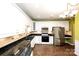 Updated kitchen with white cabinets, granite countertops, and stainless steel appliances at 8538 Highland Glen Dr, Charlotte, NC 28269