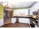 Spacious kitchen featuring white cabinets, granite countertops, and modern appliances at 8538 Highland Glen Dr, Charlotte, NC 28269