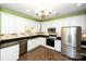 Bright kitchen with white cabinets, granite countertops, and tile flooring at 8538 Highland Glen Dr, Charlotte, NC 28269