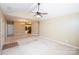 Spacious living room with vaulted ceilings and ceiling fan, awaiting personal touches and furnishings to transform the space at 8538 Highland Glen Dr, Charlotte, NC 28269