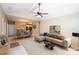 Open-concept living room showcases a comfortable sofa, dining area, and a glimpse of the kitchen with ample natural light at 8538 Highland Glen Dr, Charlotte, NC 28269