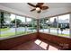 Sunroom offering views of the neighborhood, with red brick and large windows at 8538 Highland Glen Dr, Charlotte, NC 28269