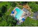 Community amenities featuring a pool, a playground, umbrellas, and lounging chairs at 10043 Elsenham Ln, Charlotte, NC 28269