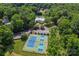 Community amenities featuring tennis courts, a pool, and parking surrounded by a green landscape at 10043 Elsenham Ln, Charlotte, NC 28269