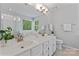 Bright bathroom with double sinks, a large mirror, and a separate shower and tub at 10043 Elsenham Ln, Charlotte, NC 28269