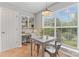 Cozy breakfast nook with natural light, featuring a table, a window, and built-in shelving at 10043 Elsenham Ln, Charlotte, NC 28269