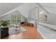 Upstairs living room with a large window, and a railing that overlooks a stairway at 10043 Elsenham Ln, Charlotte, NC 28269