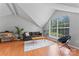 Bright living room boasts a large window, neutral tones, and comfortable seating area at 10043 Elsenham Ln, Charlotte, NC 28269