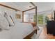 Serene main bedroom featuring a four-poster bed, neutral tones, and ample natural light at 10043 Elsenham Ln, Charlotte, NC 28269