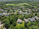Aerial view of property with lush greenery, beautiful neighborhood and convenient location at 1008 Millbridge Pkwy, Waxhaw, NC 28173
