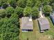 Aerial view of home showcasing landscaping, backyard patio, lawn and neighborhood setting at 1008 Millbridge Pkwy, Waxhaw, NC 28173