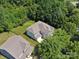 Aerial view of a lovely home with a lush green lawn surrounded by mature trees in a desirable neighborhood at 1008 Millbridge Pkwy, Waxhaw, NC 28173