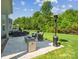 Outdoor patio with dining set, fire pit, heat lamp and seating area, excellent for gatherings at 1008 Millbridge Pkwy, Waxhaw, NC 28173