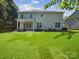 Expansive backyard with patio, lush green lawn and mature trees, ideal for outdoor activities at 1008 Millbridge Pkwy, Waxhaw, NC 28173
