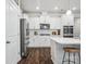 Modern kitchen featuring stainless steel appliances, white cabinets, and subway tile backsplash at 1008 Millbridge Pkwy, Waxhaw, NC 28173