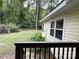 Side view from deck showing home's siding and spacious backyard with lush greenery at 1010 Sprucewood St, Kannapolis, NC 28081
