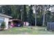 Spacious backyard with shed, covered area, and mature trees at 1010 Sprucewood St, Kannapolis, NC 28081