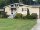 Charming home featuring a traditional design, landscaped front yard, and inviting entryway at 1010 Sprucewood St, Kannapolis, NC 28081
