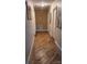 Hallway featuring hardwood floors, neutral walls, and access to multiple rooms at 1010 Sprucewood St, Kannapolis, NC 28081