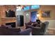 Comfortable living room featuring a brick fireplace, hardwood floors and natural light at 1010 Sprucewood St, Kannapolis, NC 28081