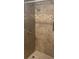 Bathroom featuring ceramic tiled shower, decorative border, and modern shower head at 1010 Sprucewood St, Kannapolis, NC 28081