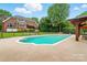 Expansive backyard with pool, gazebo, and lush green space at 1042 Heather Glen Dr, Matthews, NC 28104