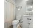 Cozy bathroom featuring a shower with curtain, toilet, and sink with vanity at 1042 Heather Glen Dr, Matthews, NC 28104