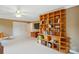 Spacious bonus room features custom shelving, providing ample storage at 1042 Heather Glen Dr, Matthews, NC 28104