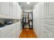 Spacious walk-in closet features custom built-ins, ample storage, and a skylight at 1042 Heather Glen Dr, Matthews, NC 28104