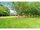 Lovely home with a large front yard featuring mature trees and a well-maintained lawn at 1042 Heather Glen Dr, Matthews, NC 28104