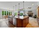 Spacious kitchen island with stainless steel appliances, granite countertops, and ample cabinet space at 1042 Heather Glen Dr, Matthews, NC 28104