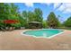 Beautiful pool area featuring a gazebo, mature trees, and ample space for entertaining at 1042 Heather Glen Dr, Matthews, NC 28104
