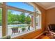 View from the window showcasing a backyard deck, pool, and beautifully landscaped yard at 1042 Heather Glen Dr, Matthews, NC 28104