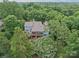 Aerial view of estate home surrounded by lush trees at 106 Boyter Ct, Cramerton, NC 28032