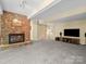 Finished basement featuring a stone fireplace and entertainment area at 106 Boyter Ct, Cramerton, NC 28032