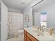 This clean bathroom features a shower-tub combination and a light-colored vanity with plenty of storage space at 106 Boyter Ct, Cramerton, NC 28032