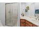 Bathroom featuring a glass-door shower, vanity with storage, quartz countertops, and modern fixtures at 106 Boyter Ct, Cramerton, NC 28032