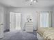 Spacious bedroom with a gray color scheme, carpeted floors, a closet, and plenty of natural light at 106 Boyter Ct, Cramerton, NC 28032