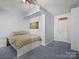 Cozy bedroom featuring a blue color scheme, plush carpeting, ceiling fan and a comfortable bed, perfect for relaxation at 106 Boyter Ct, Cramerton, NC 28032