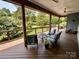 Spacious covered deck providing ample space for seating and enjoying the outdoor scenery at 106 Boyter Ct, Cramerton, NC 28032