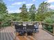 Outdoor deck with dining set and scenic backyard views at 106 Boyter Ct, Cramerton, NC 28032