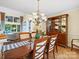 Traditional dining room featuring a chandelier, wooden table, and built-in cabinet at 106 Boyter Ct, Cramerton, NC 28032