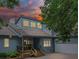 Inviting home featuring a front porch, well-maintained landscaping, and a side-entry garage at 106 Boyter Ct, Cramerton, NC 28032