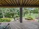 Covered patio with outdoor seating and view of the landscaped backyard at 106 Boyter Ct, Cramerton, NC 28032